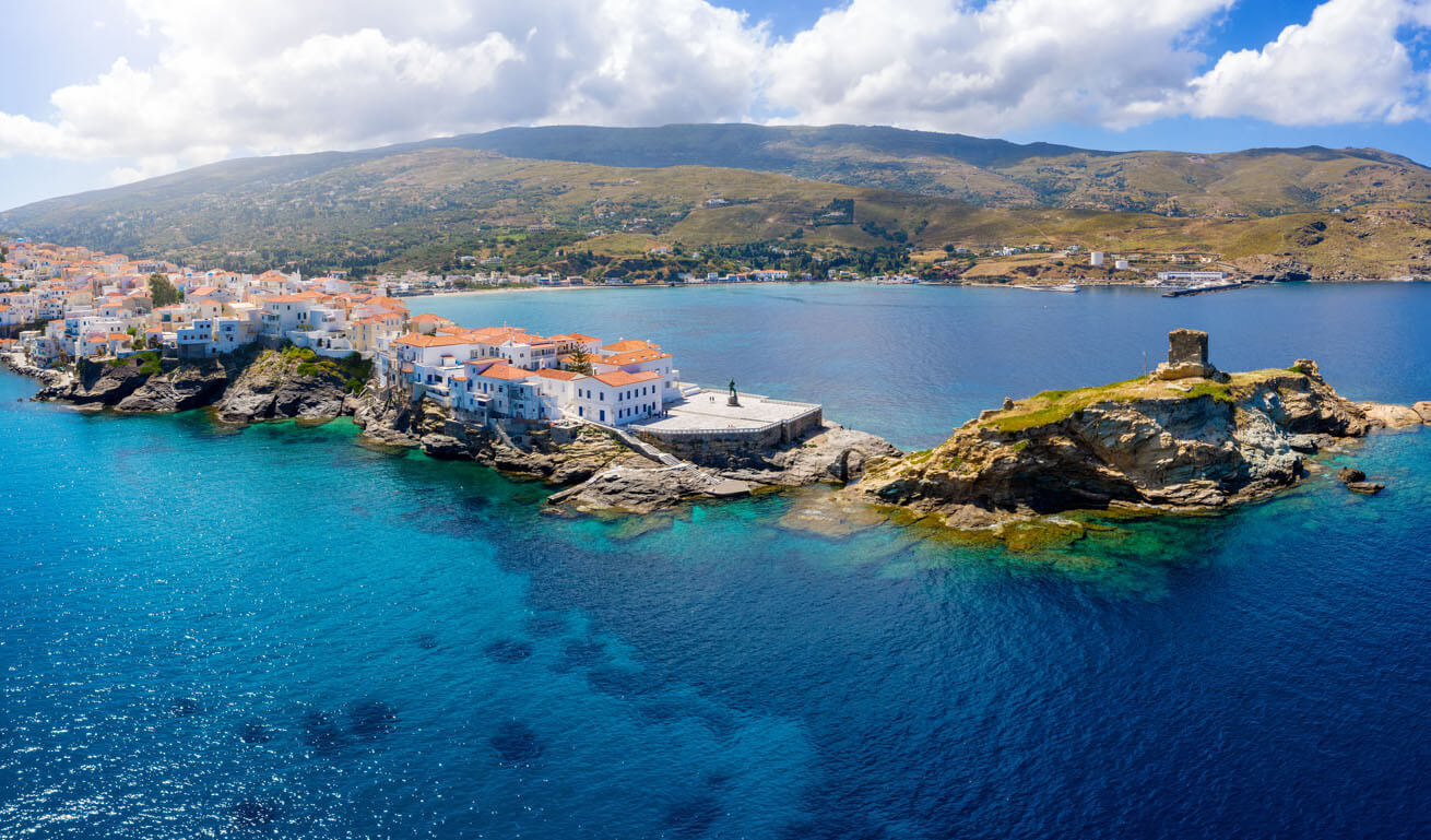 Aerial view of Peninsula with a traditional settlement and in the background 2 beaches and hills. 