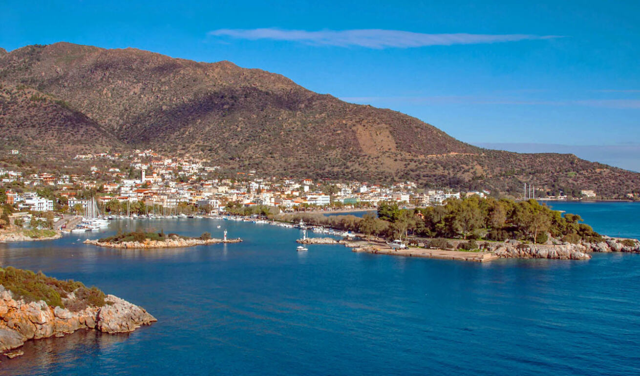 Methana with the traditional houses and the port and in the middle a small islet