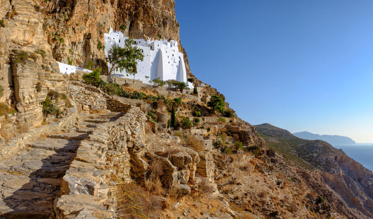 Large white church on high cliffs above the sea 