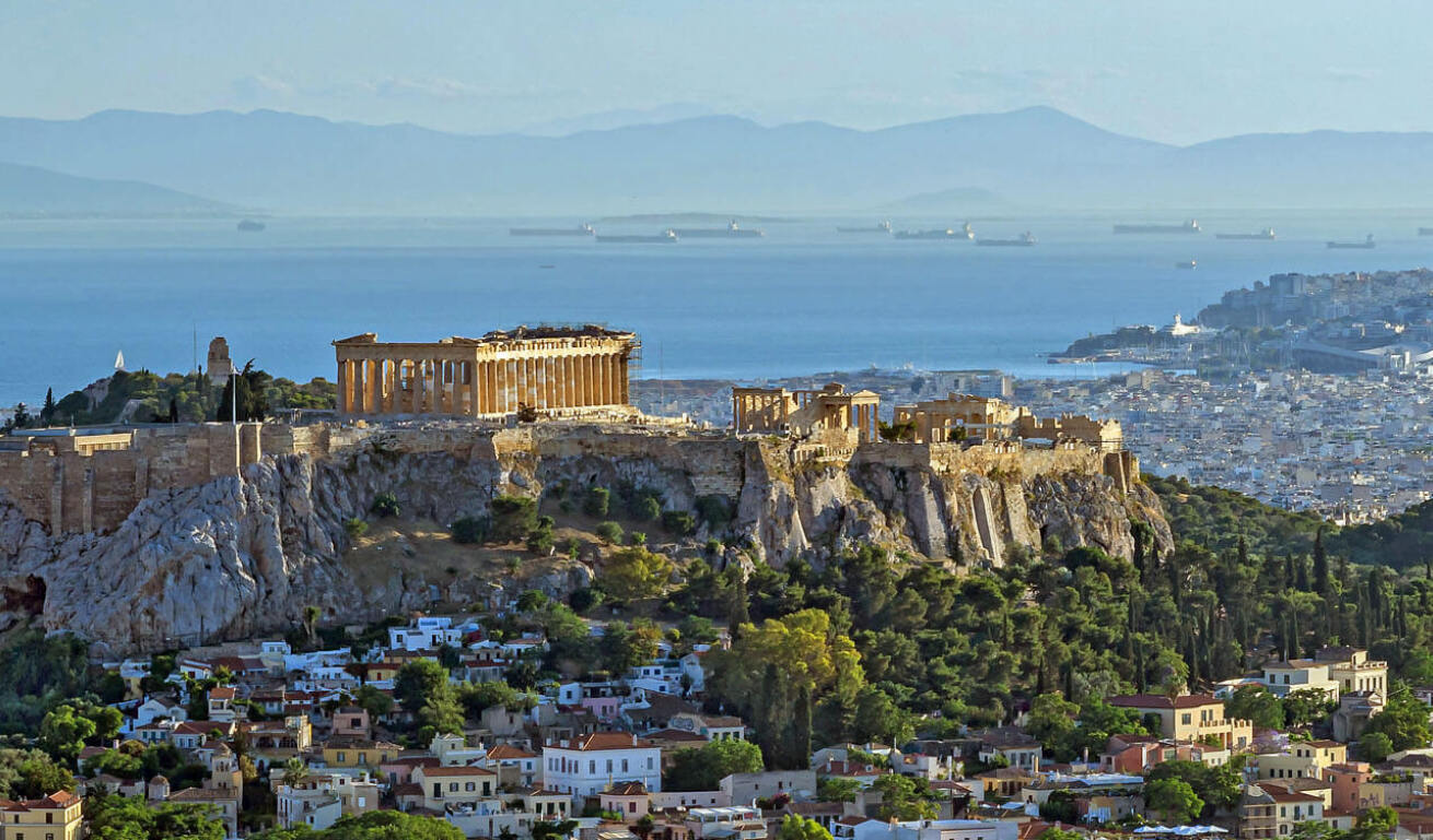 View of Athens with picturesque houses and in the background Acropolis is seen 