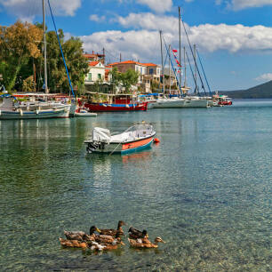 Picturesque village of the island with many fishing boats and greenish blue waters