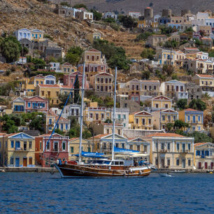 View of the colorful houses in the port and at the center there is a large fishing boat