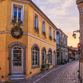 Shot of a cobblestone alley with traditional colourful houses
