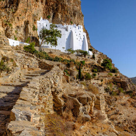 Large white church on high cliffs above the sea 