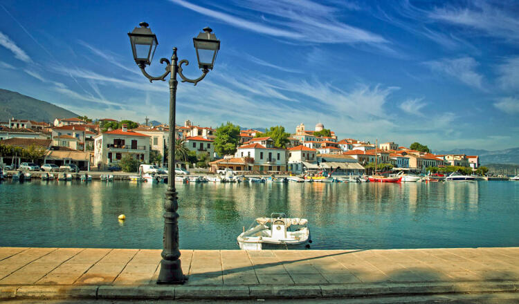 View of the port of the village, with many fishing boats and in the background traditional houses