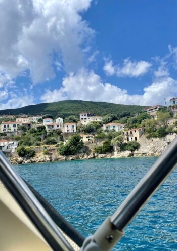 photo taken from a sailing boat with view of island settlement