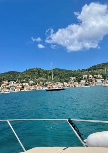 photo taken from a sailing boat with view of island settlement