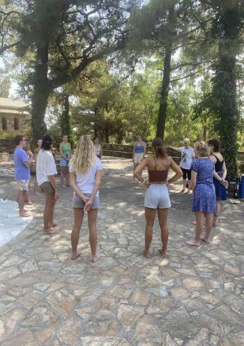 people standing in a circle in the nature