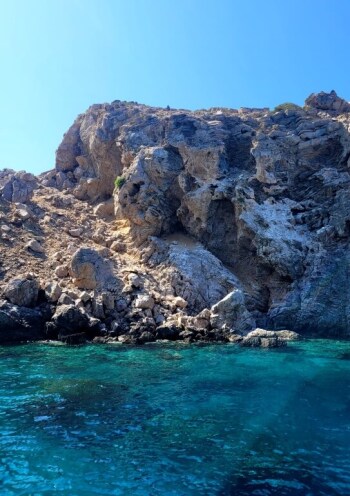 rocks formation in light green water, sea